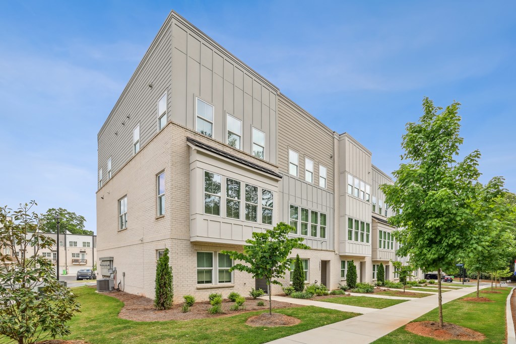 A modern building with a flat roof and large windows.
