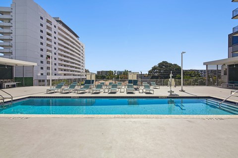 Resort-style swimming pool with sun deck at Riverview One Apartments in Downtown Miami near Brickell, the Miami River, Bayside Marketplace, and Miami Worldcenter.