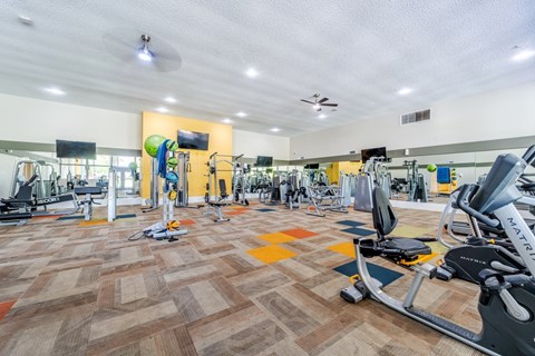 Fully equipped fitness center at Sono Tempe Apartments in Tempe, Arizona with cardio machines and strength equipment.