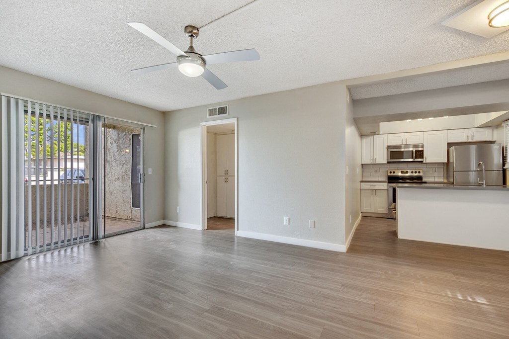 Spacious living room with large sliding door windows at Sono Tempe, a pet-friendly community in Tempe near downtown Tempe, AZ.