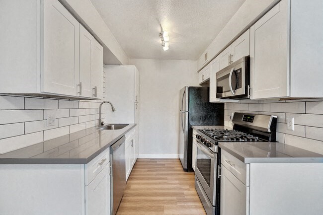 Kitchen with stainless steel appliances and ample cabinet space at Sono Tempe, a pet-friendly community in Tempe near downtown Tempe, AZ.