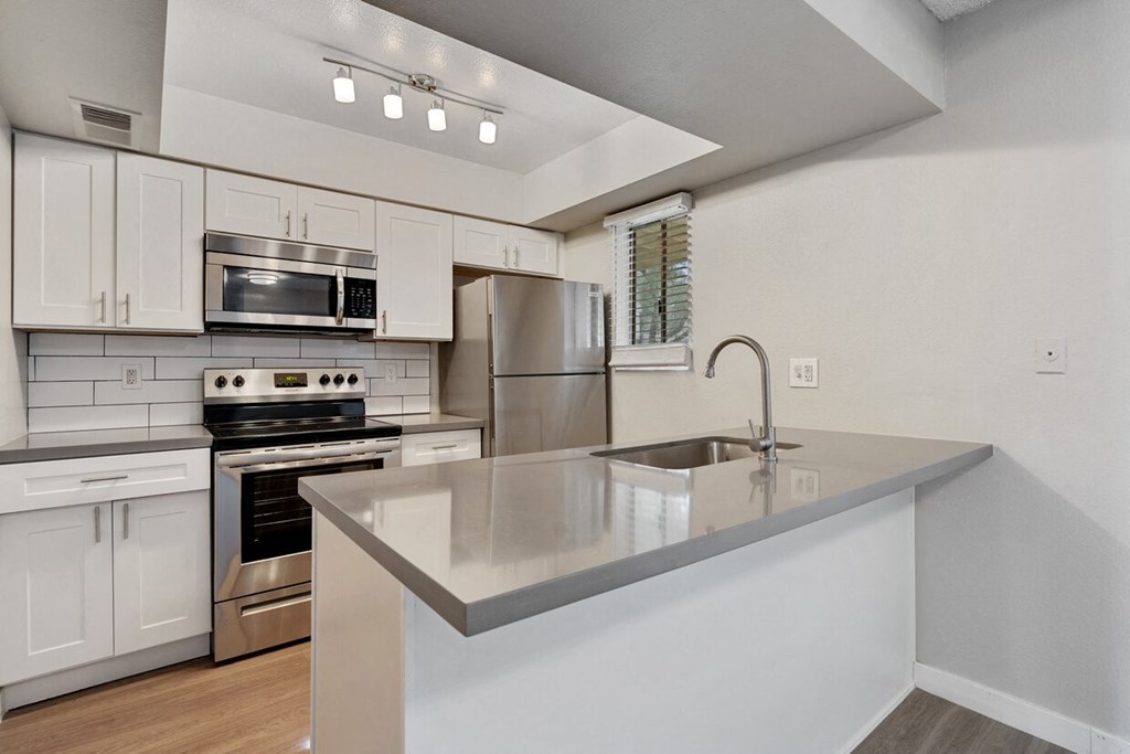 Spacious eat-in kitchen with stainless steel appliances at Sono Tempe, a pet-friendly community in Tempe near downtown Tempe, AZ.