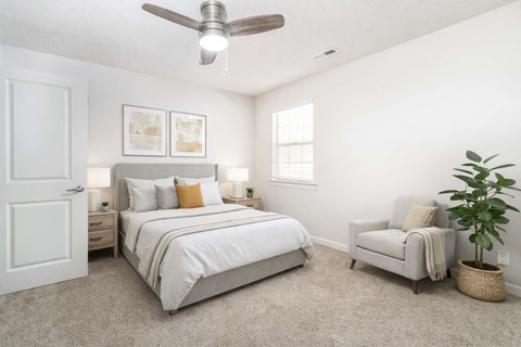 Modern apartment bedroom with natural light at Sugar Creek Apartments Winston Salem