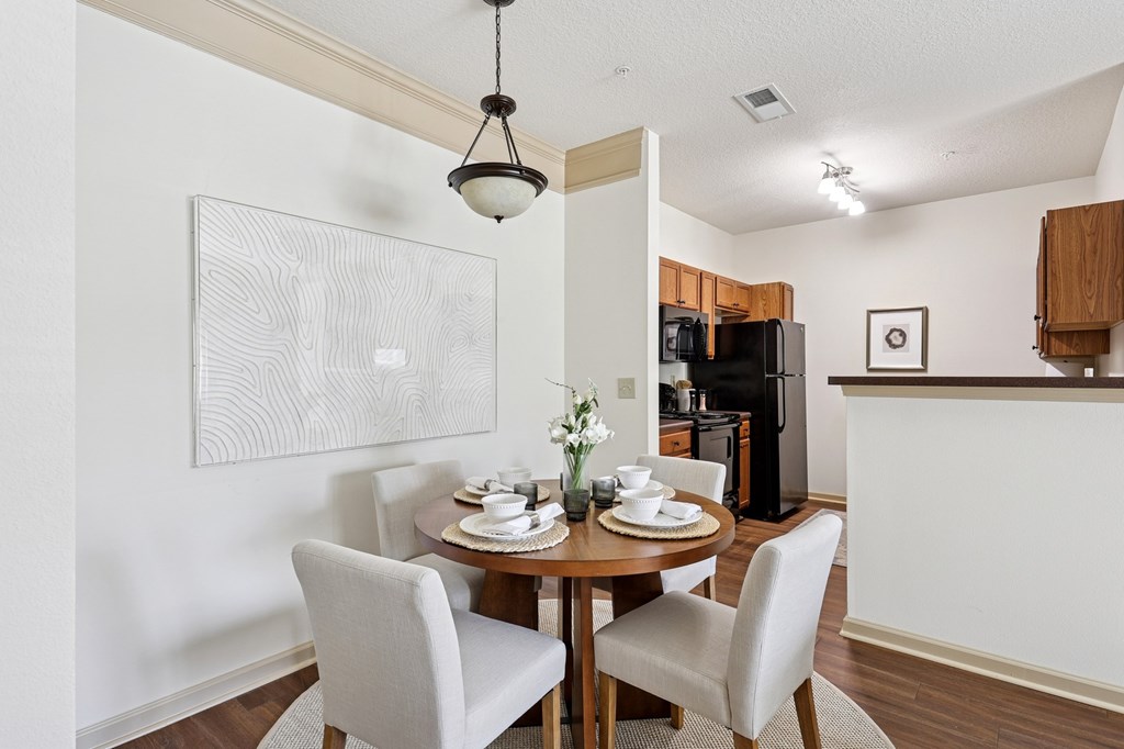 Open-concept dining area next to the kitchen at Tattersall Village Apartments near Richmond Hill, GA