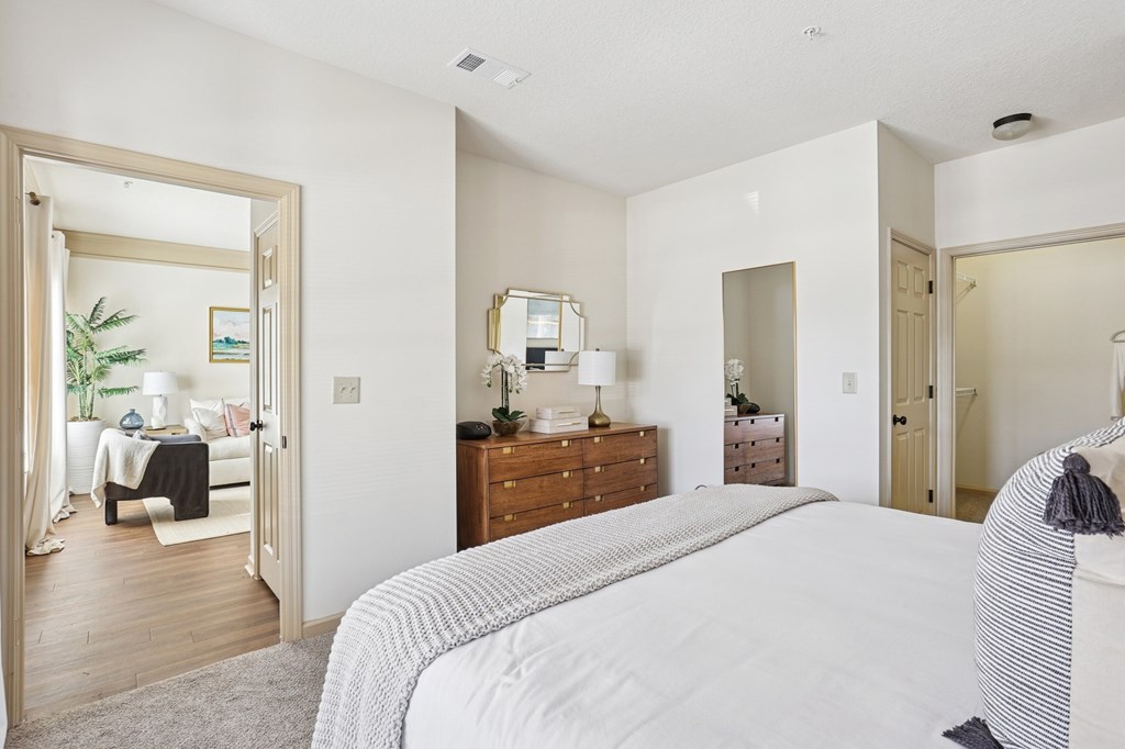 Spacious bedroom with natural light and neutral decor in Tattersall Village Apartments, Hinesville, GA