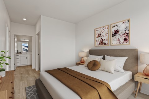 A bedroom with a large bed and a view of a balcony.