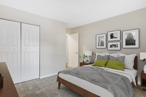a bedroom with a large bed and a closet
