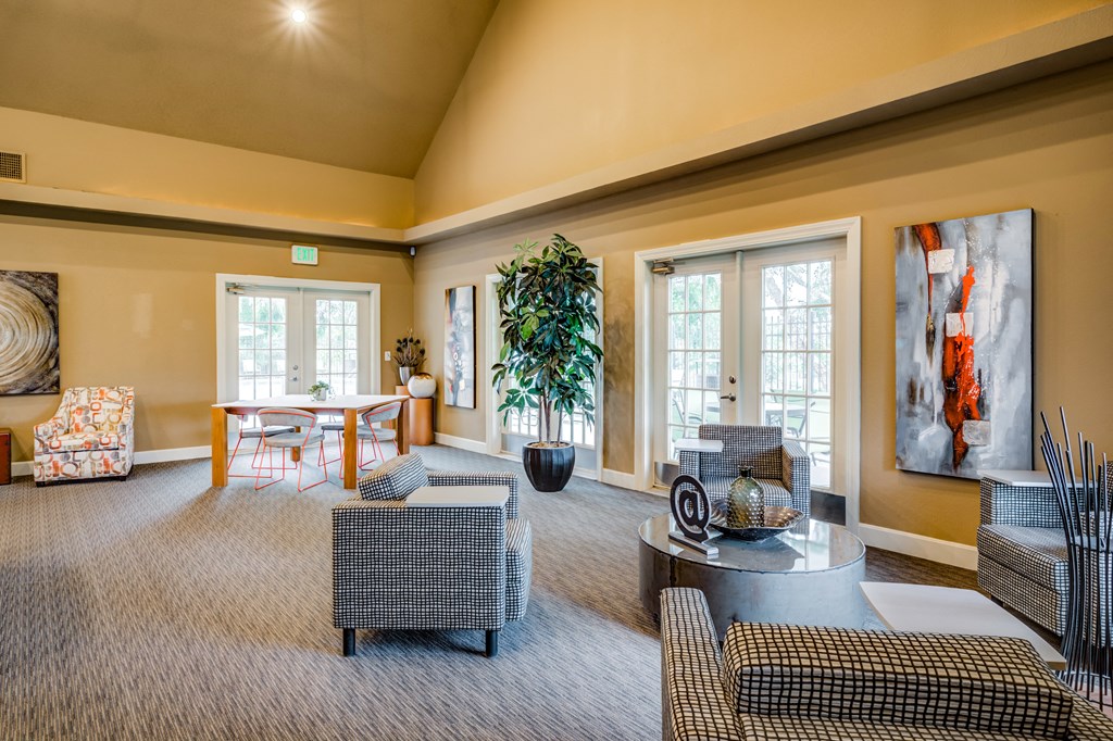 a large living room with couches and chairs