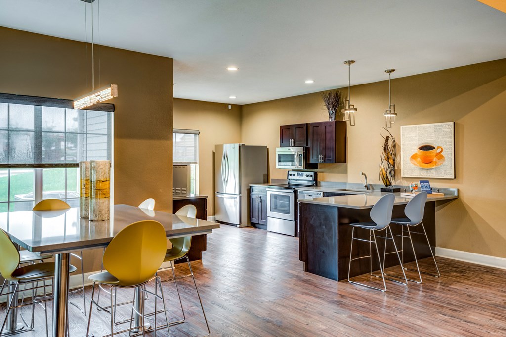a kitchen and dining area in the club house