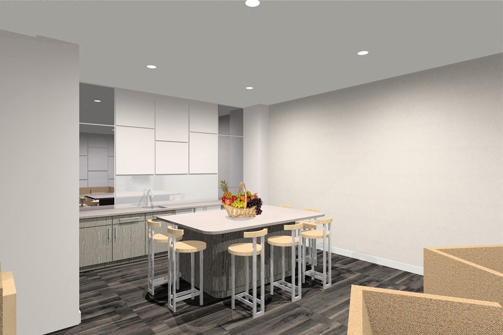 a kitchen and dining area with a table and chairs