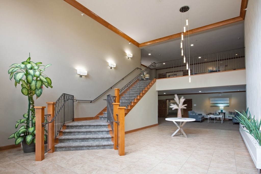 Laurel East End Apartments in Golden Valley, MN photo of the lobby of a building with a staircase and a potted plant