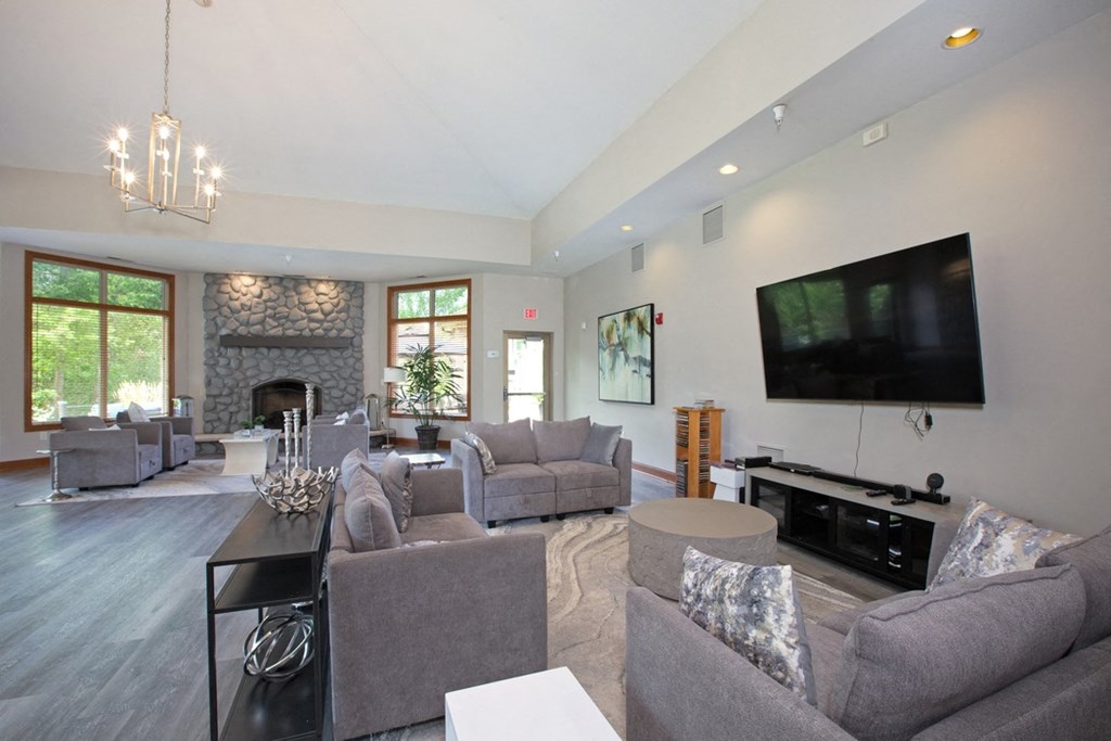 Laurel East End Apartments in Golden Valley, MN photo of a living room with couches and a tv and a fireplace