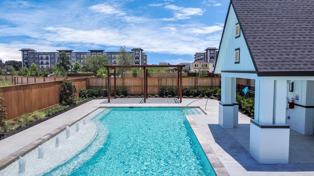 Heights, Houston TX Homes for Rent - The Crossing at Timbergrove - Refreshing Blue Pool with Fountains and Plant Beds, in a Wood-Fenced Enclosure