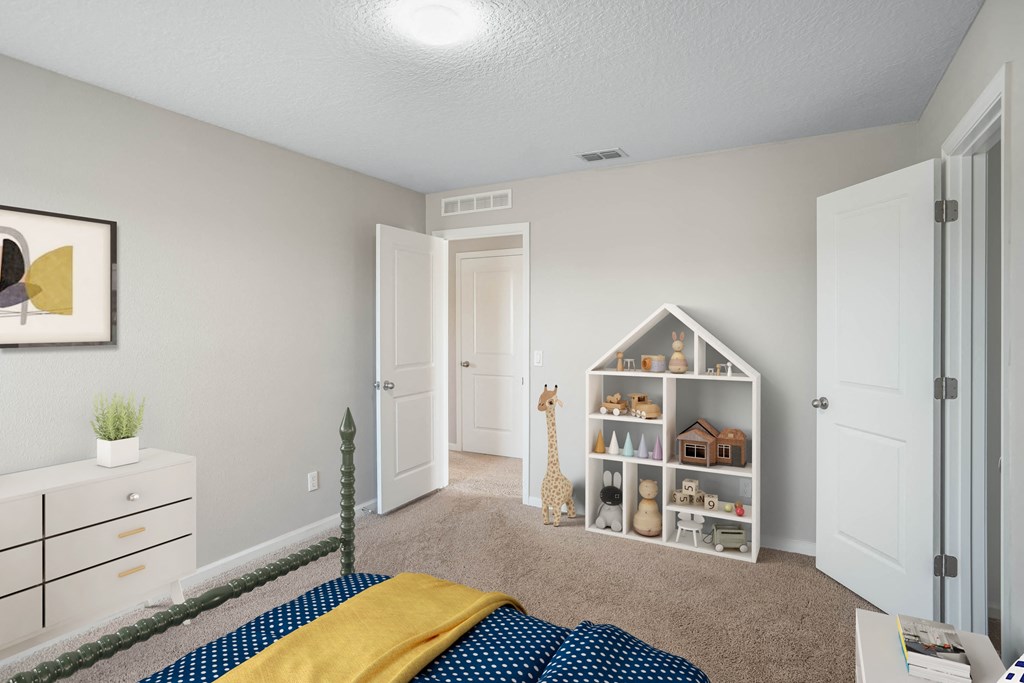 A room with a bed, a dresser, and a bookshelf.
