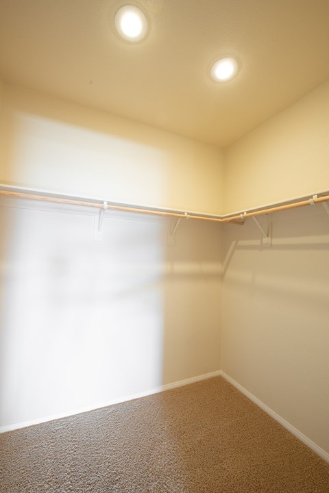 an empty room with a white wall and a white curtain