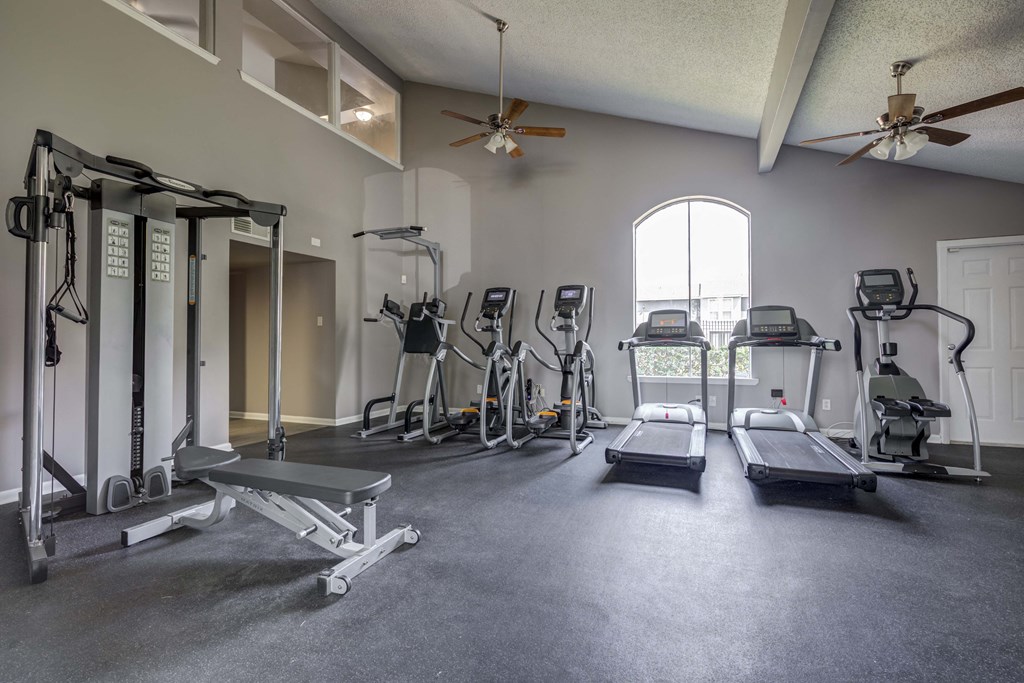 Westchase Apartments in Harvey LA photo of fitness center with cardio equipment and strength training