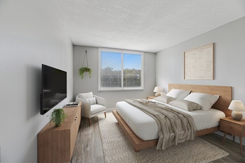 Large primary bedroom in updated apartment at Wilton Tower in Wilton Manors, Florida.