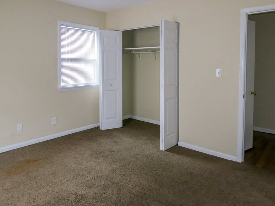 Apartment Bedroom with Closet and Window