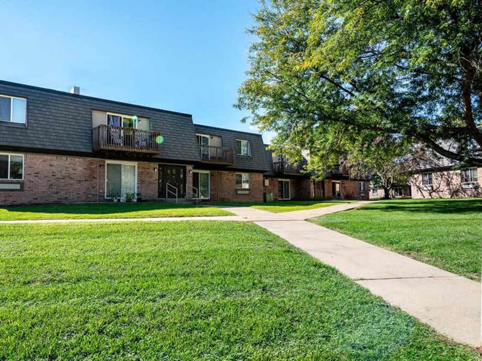 apartment complex with shade trees
