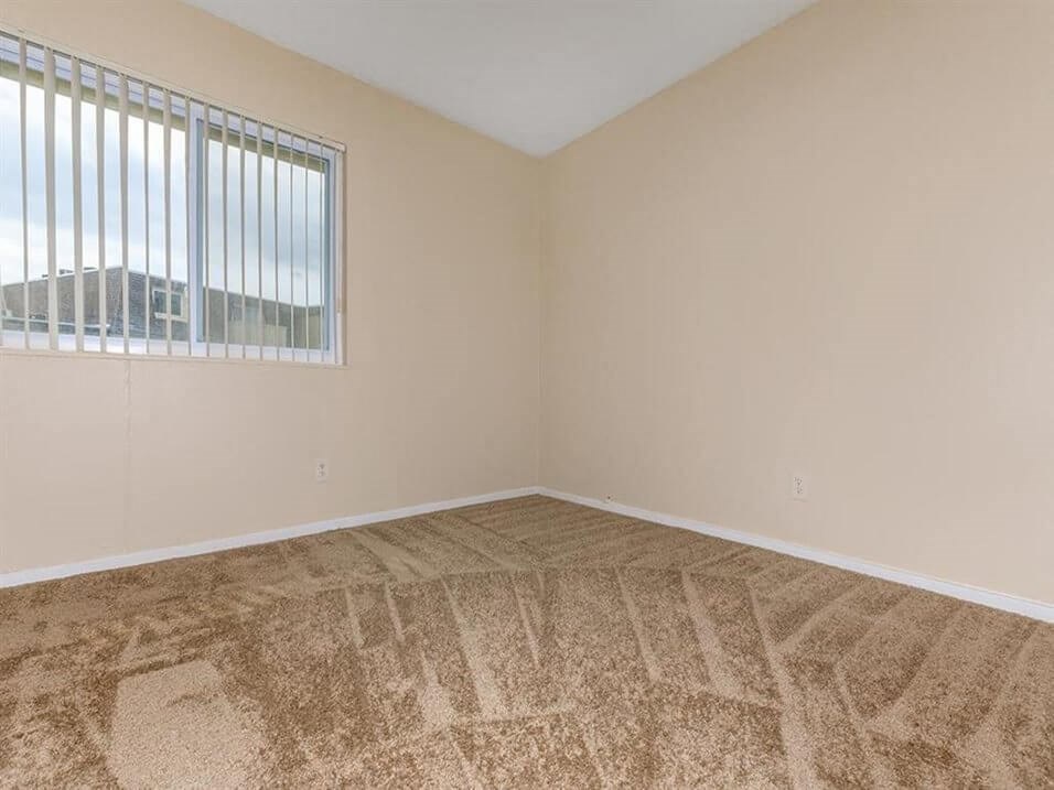 carpeted bedroom at Arbors of Grandview