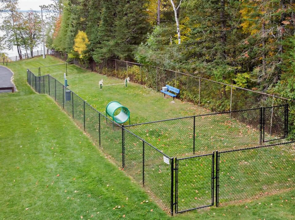 fenced in dog park at Les Chateaux apartments