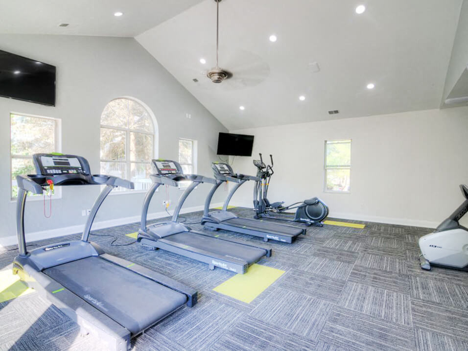 fitness center with cardio machines