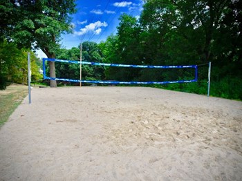 sand volleyball court at The Bronco Club Apartments - Photo Gallery 3