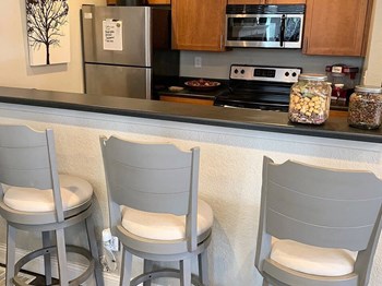 fully equipped kitchen at Prairie Walk apartments clubhouse - Photo Gallery 4