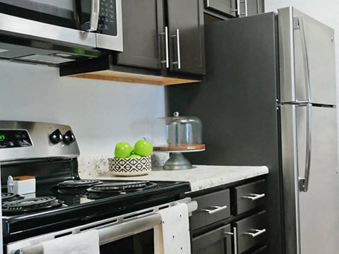 a kitchen with a stove and a refrigerator