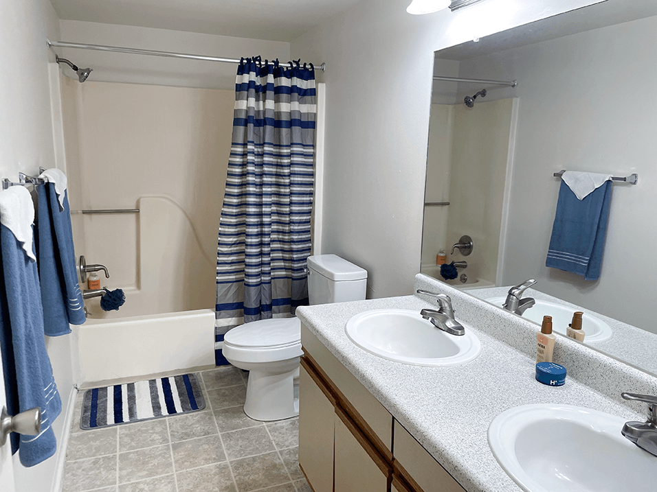 a bathroom with a toilet sink and tub