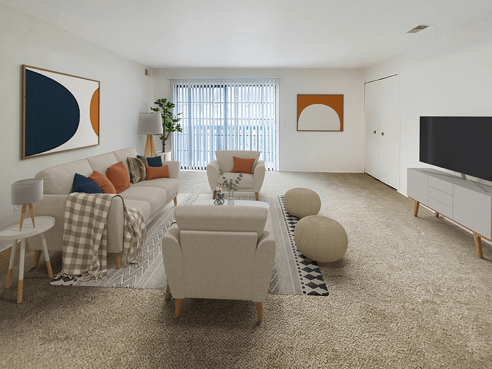 a living room with white walls and carpet