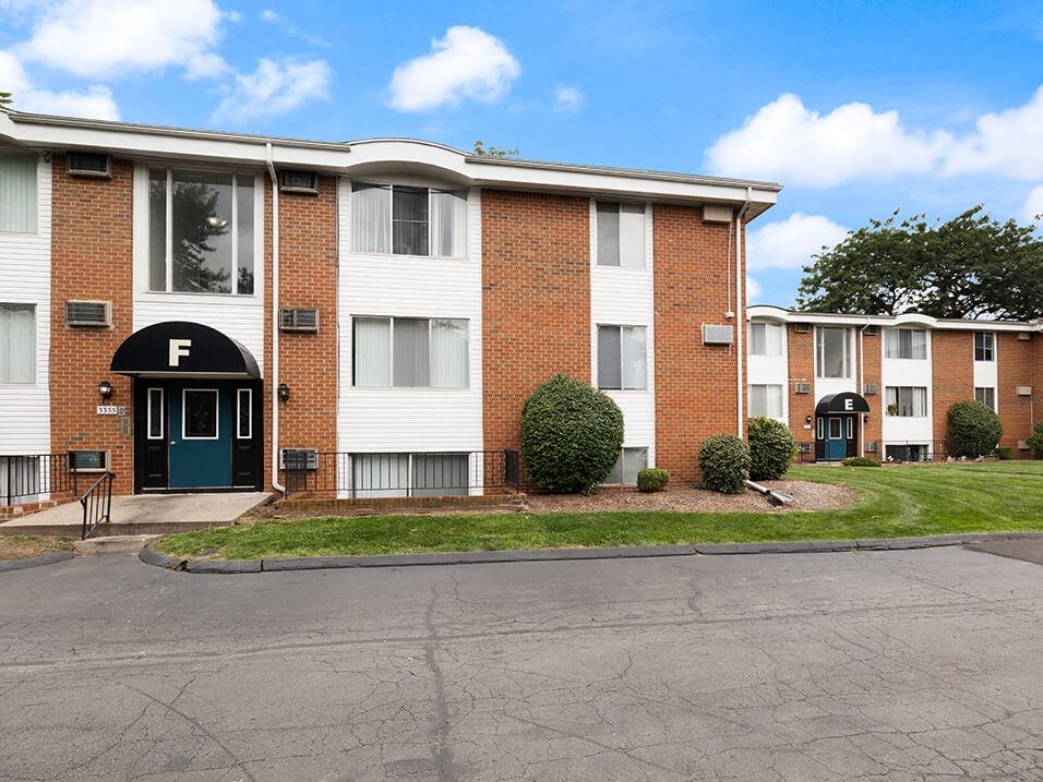 an apartment building with street parking