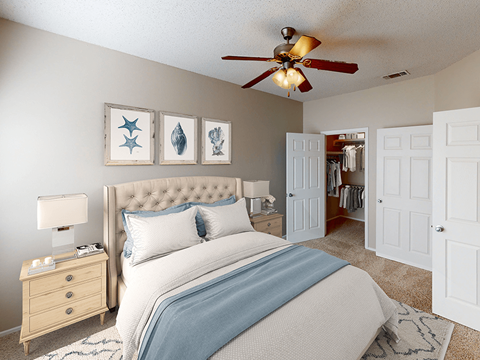 a bedroom with a bed and a ceiling fan
