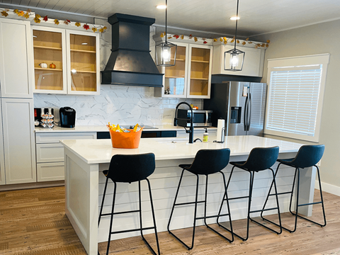 apartment kitchen with a center island and bar stools