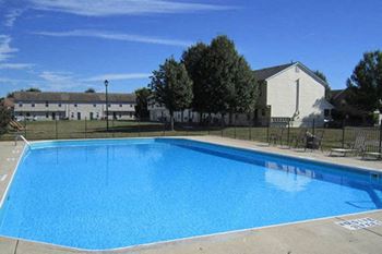 outdoor swimming pool amenity at apartment complex