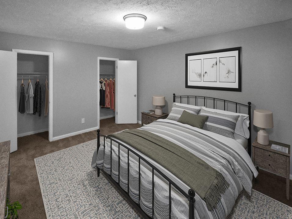 a bedroom with a bed and two closets
