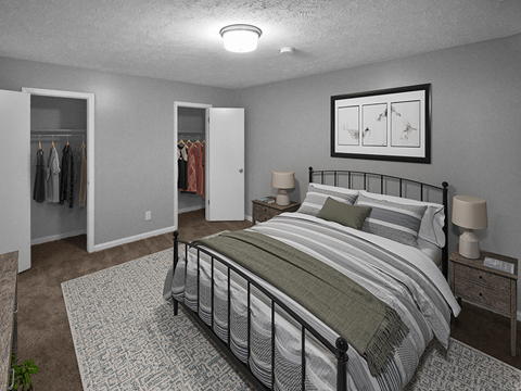 a bedroom with a bed and two closets