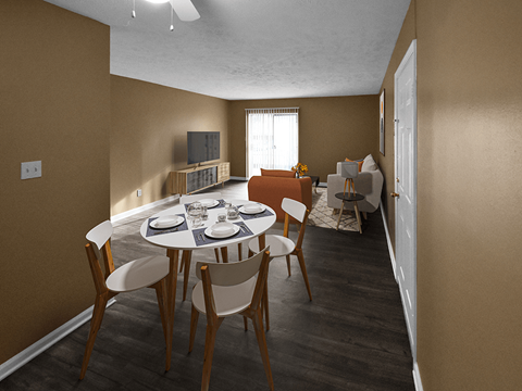 a dining area with a table and chairs and a living room in the background