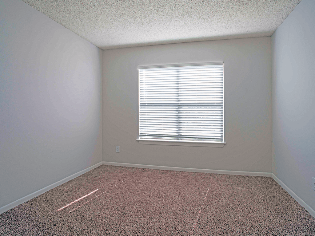 an empty room with a window in it