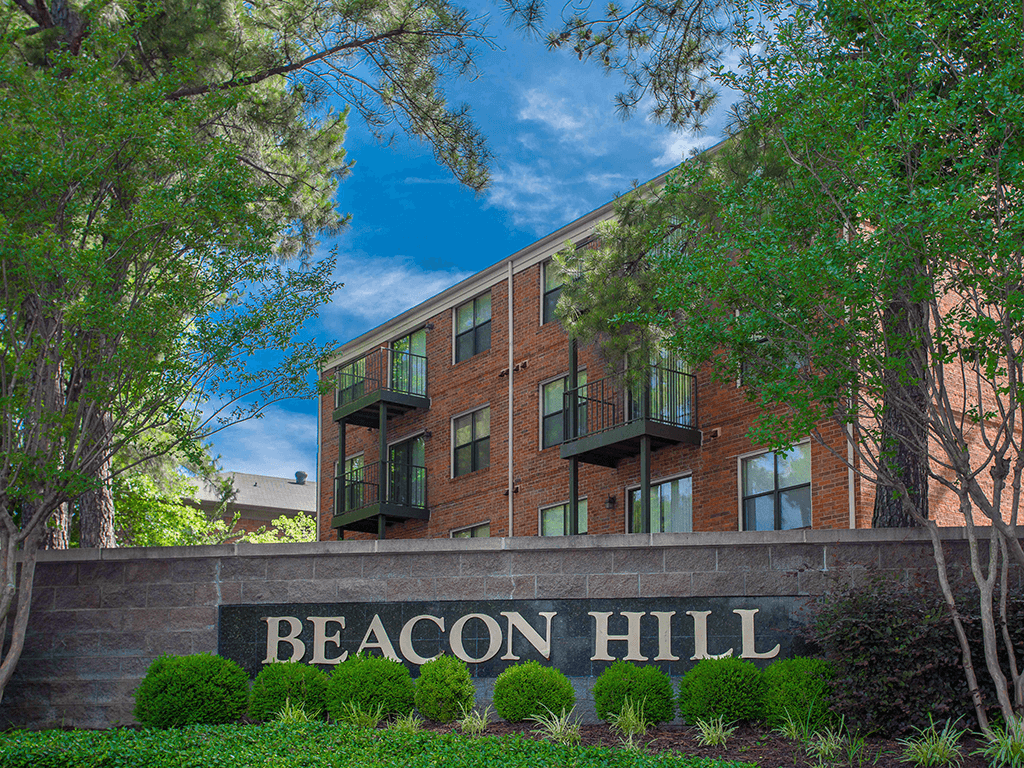 a large brick building with a sign that reads beacon hill
