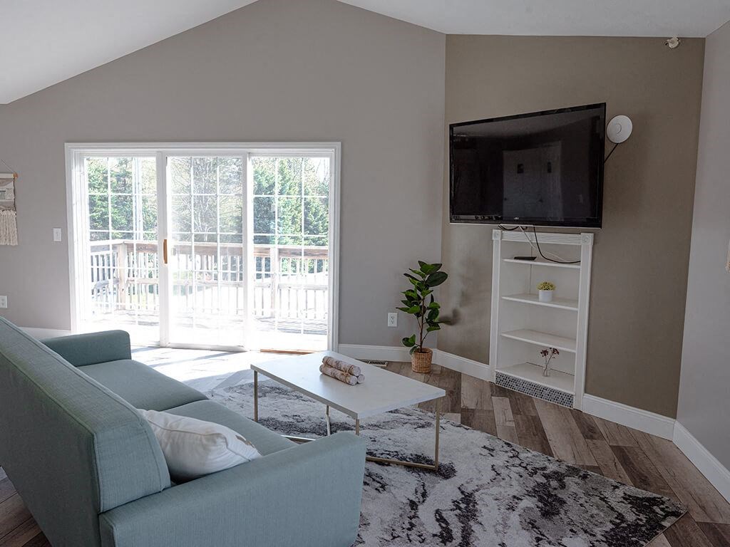 clubhouse at Bloomfield with blue couch and a television