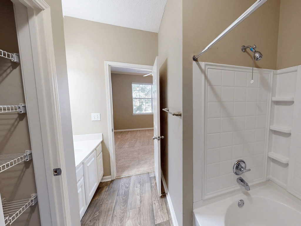 bathroom with a shower tub