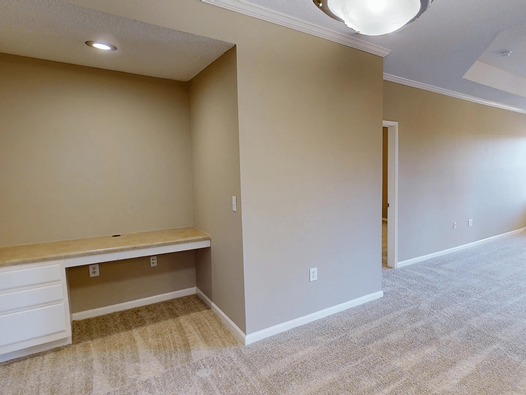apartment with bonus room with an office desk