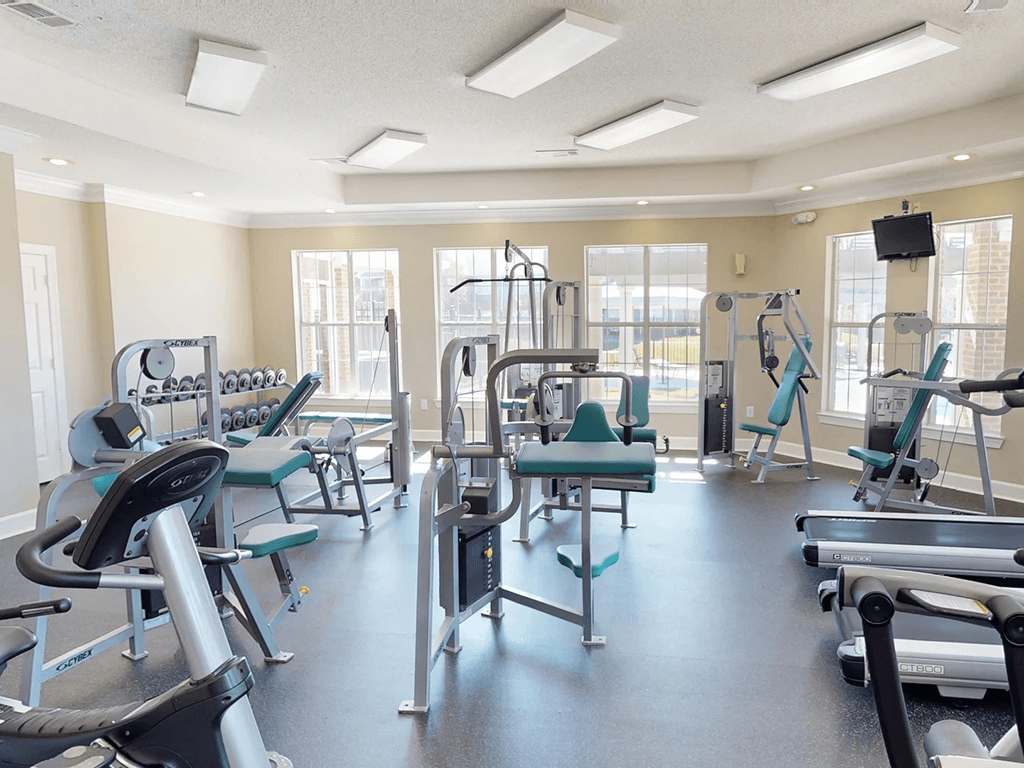 fitness room with weights and other exercise equipment