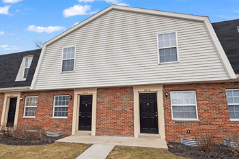 A house with a black door and windows.