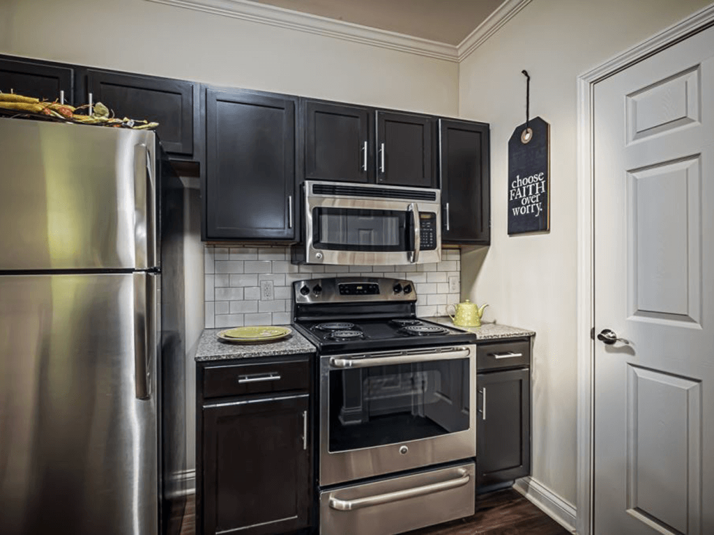 Apartment kitchen with stainless steel appliances
