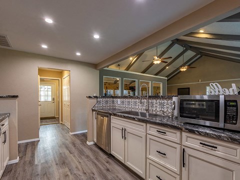 a kitchen with a microwave and a counter top