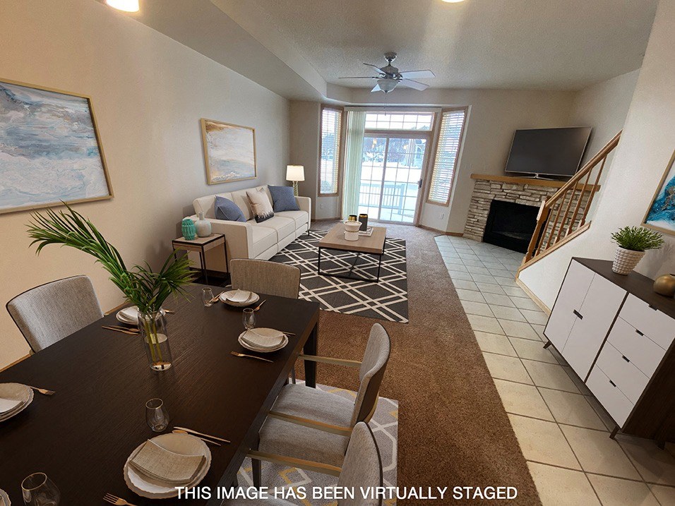 a view of a living room and dining room in a two bedroom apartment
