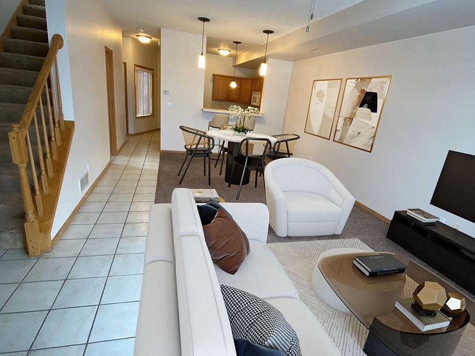 a living room with a couch a chair and a table