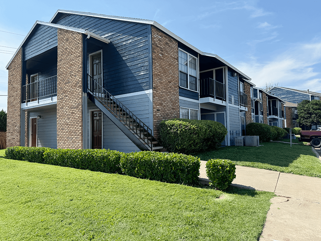 our apartments are located in a quiet neighborhood with green grass